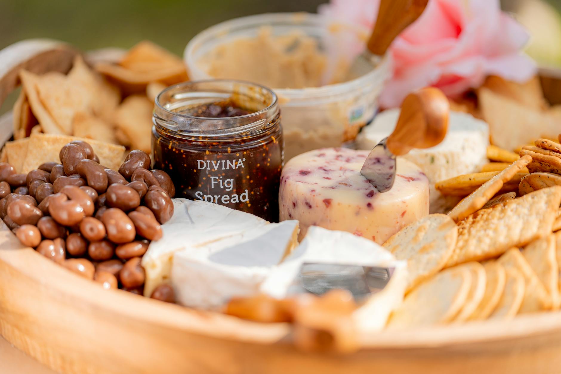 Chocolate Charcuterie Board Guide: Effortless Tips for Decadent Delights A gourmet platter of cheeses, fig spread, and assorted crackers, perfect for a picnic.