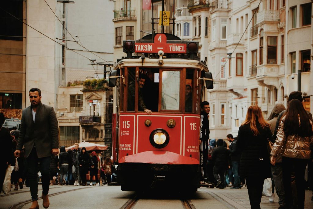 Chocolate History: Best Fascinating Journey Iconic Istanbul tram navigating through a busy street, capturing urban life and architecture.