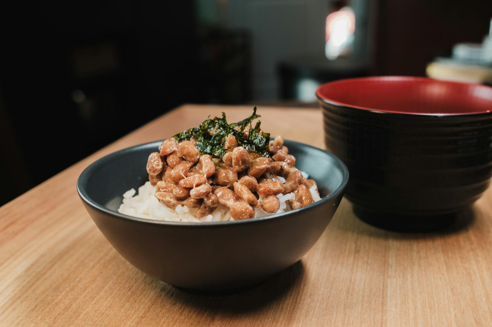 Vegan Chocolate: Best Brands for Irresistible Indulgence Close-up of a traditional Japanese breakfast bowl with natto and rice, capturing cultural essence.